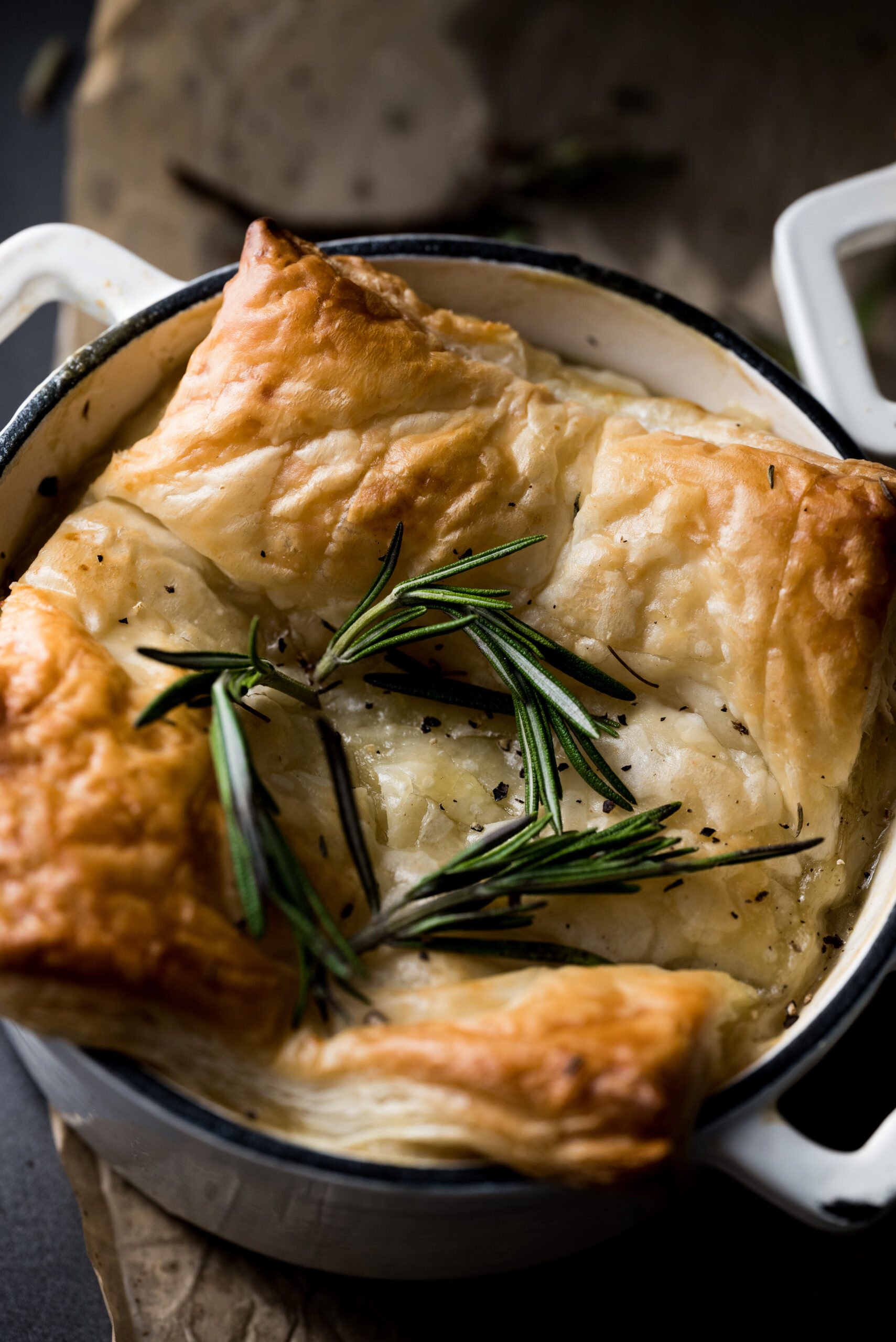 Puff pastry pot pie with fresh rosemary on top. 