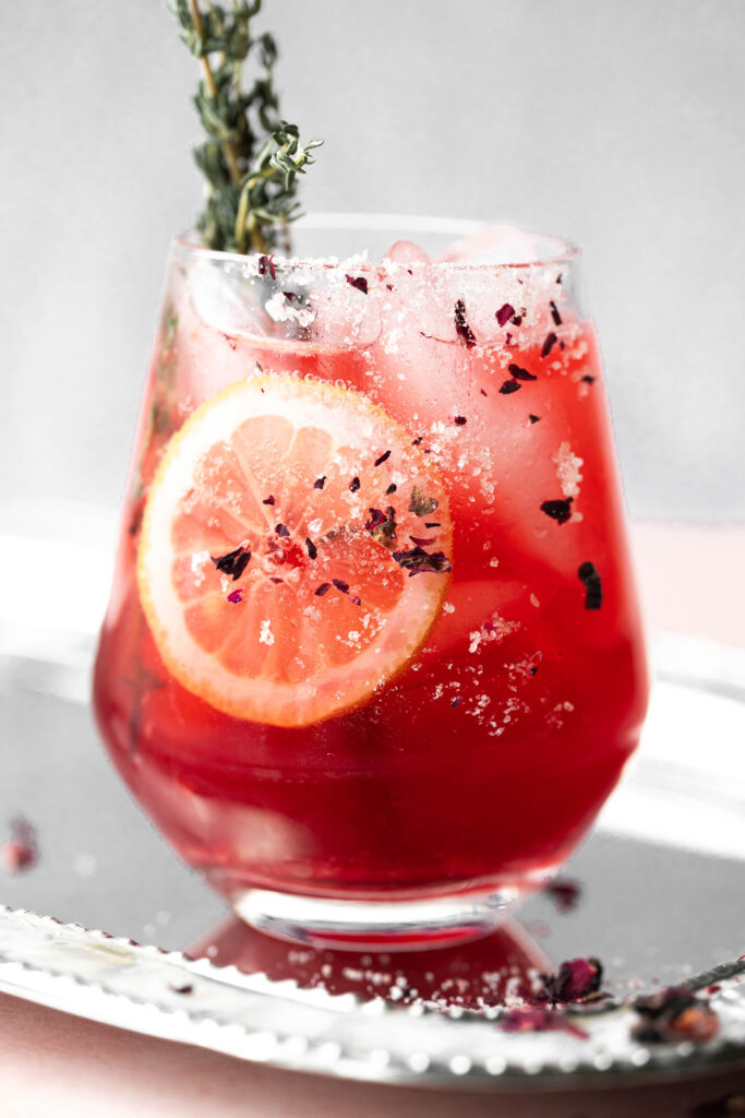 Hero shot of rose tea in a wine glass. 