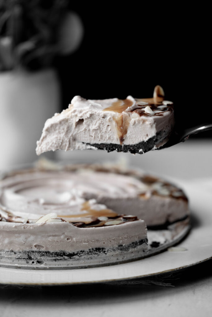 Photo of a slice of Billy Miner Pie coming out of the springform pan. 