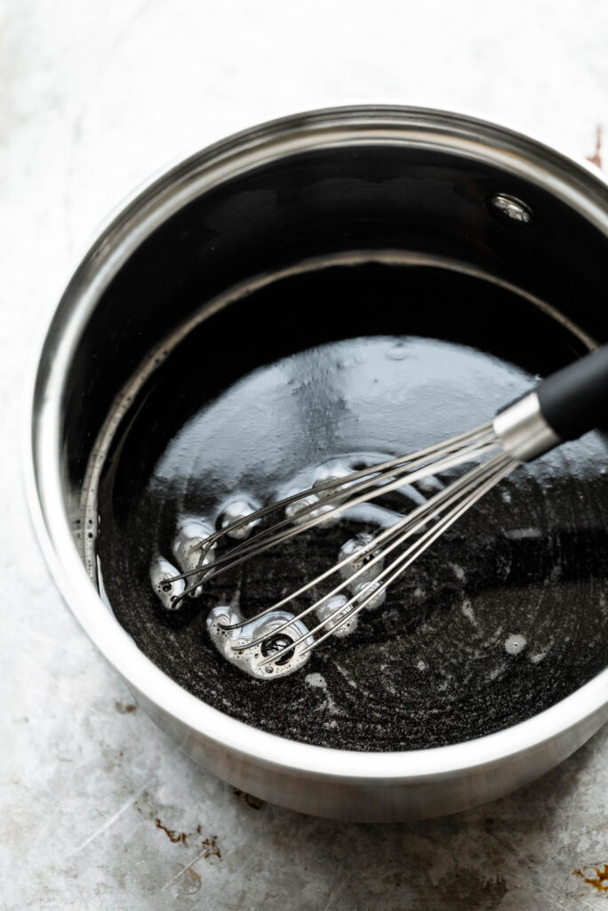 Process shot of brown sugar syrup in a sauce pan. 