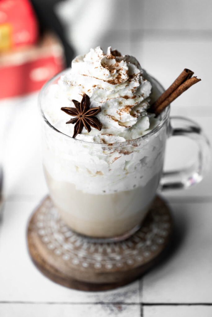 Chai tea latte with cinnamon and whipped cream. 