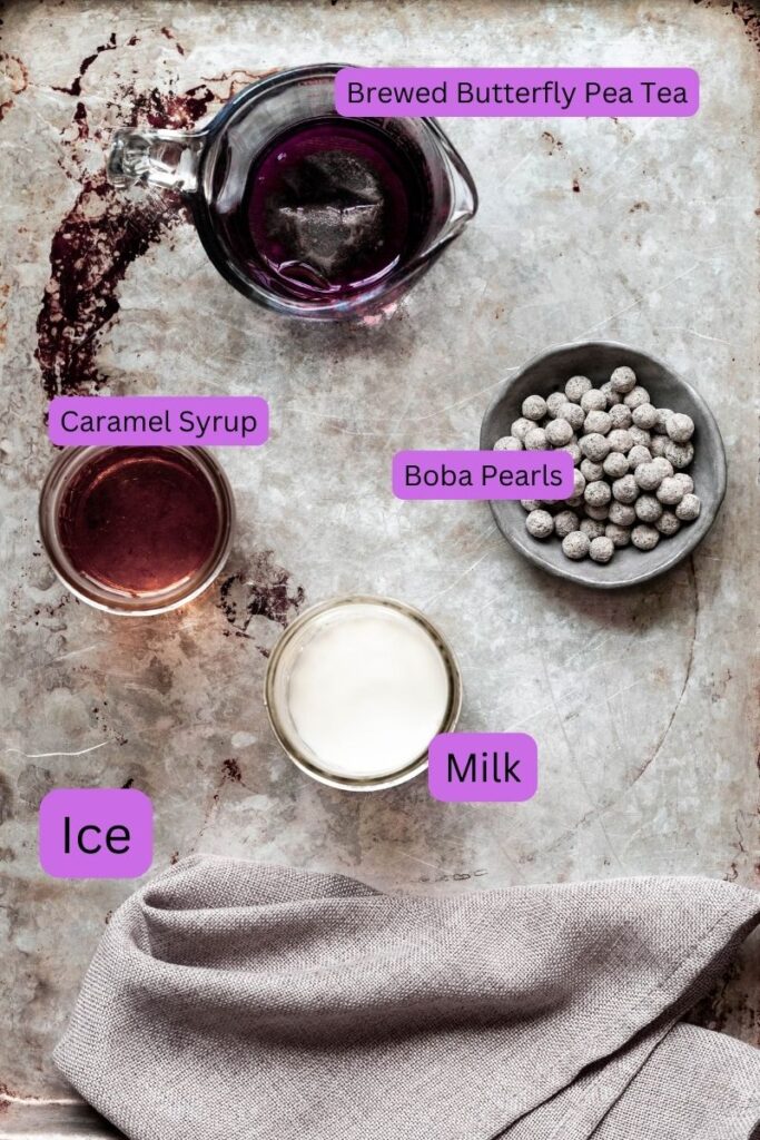 labeled ingredients needed to make butterfly pea bubble milk tea. 