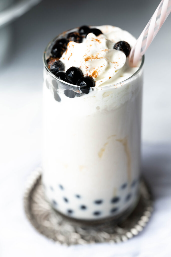 Pumpkin Spice Boba Milk Tea with whipped cream and boba pearls.  