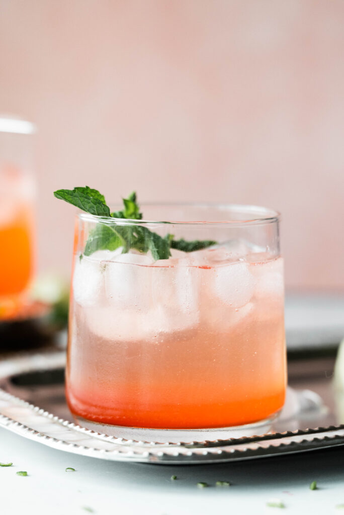 Side view of the strawberry mint mojito mocktail with soda water. 