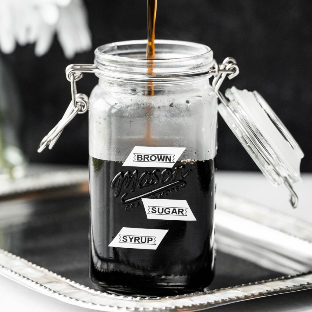 Brown sugar syrup for boba in a labeled mason jar. 