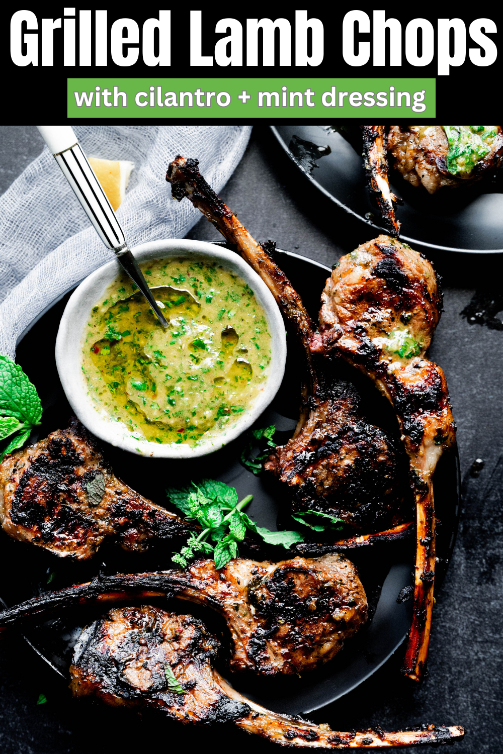 Lamb chops on a black background Pinterest Pin. 