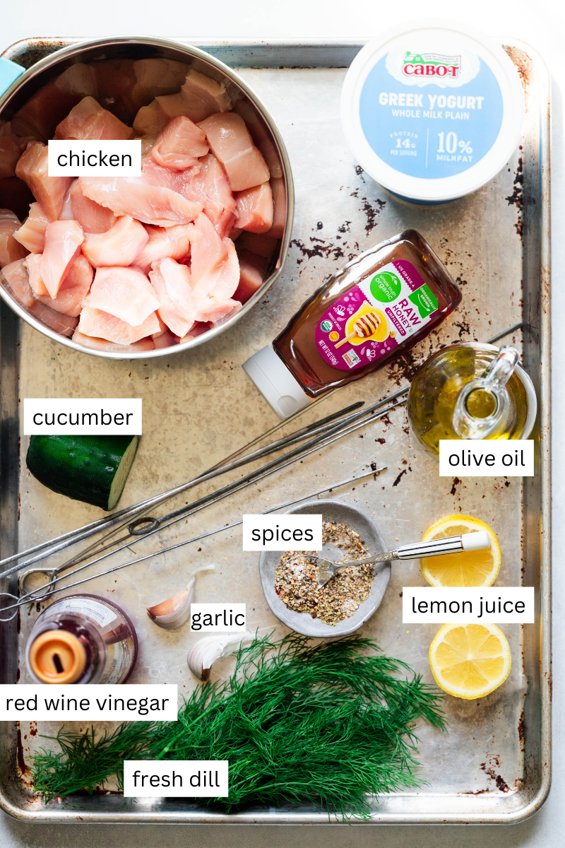 Ingredients needed to make chicken with yogurt sauce on a sheet pan. 