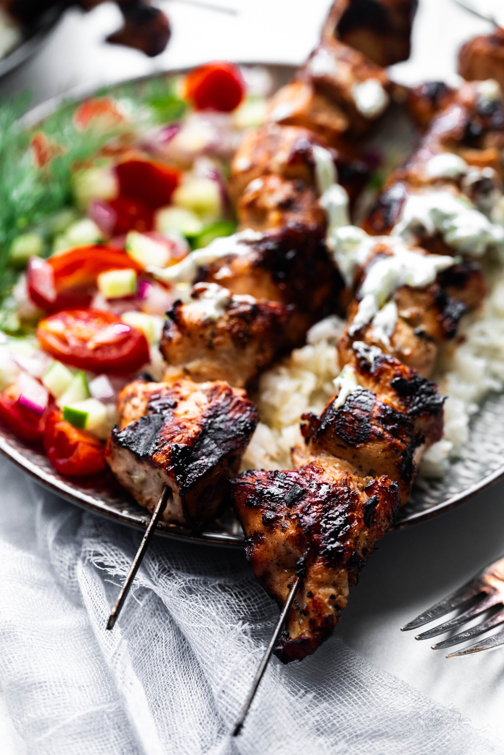 Close up of the chicken breasts on skewers. 