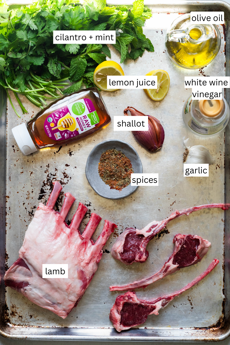 Ingredients on a sheet pan needed to make grilled lamb chops. 