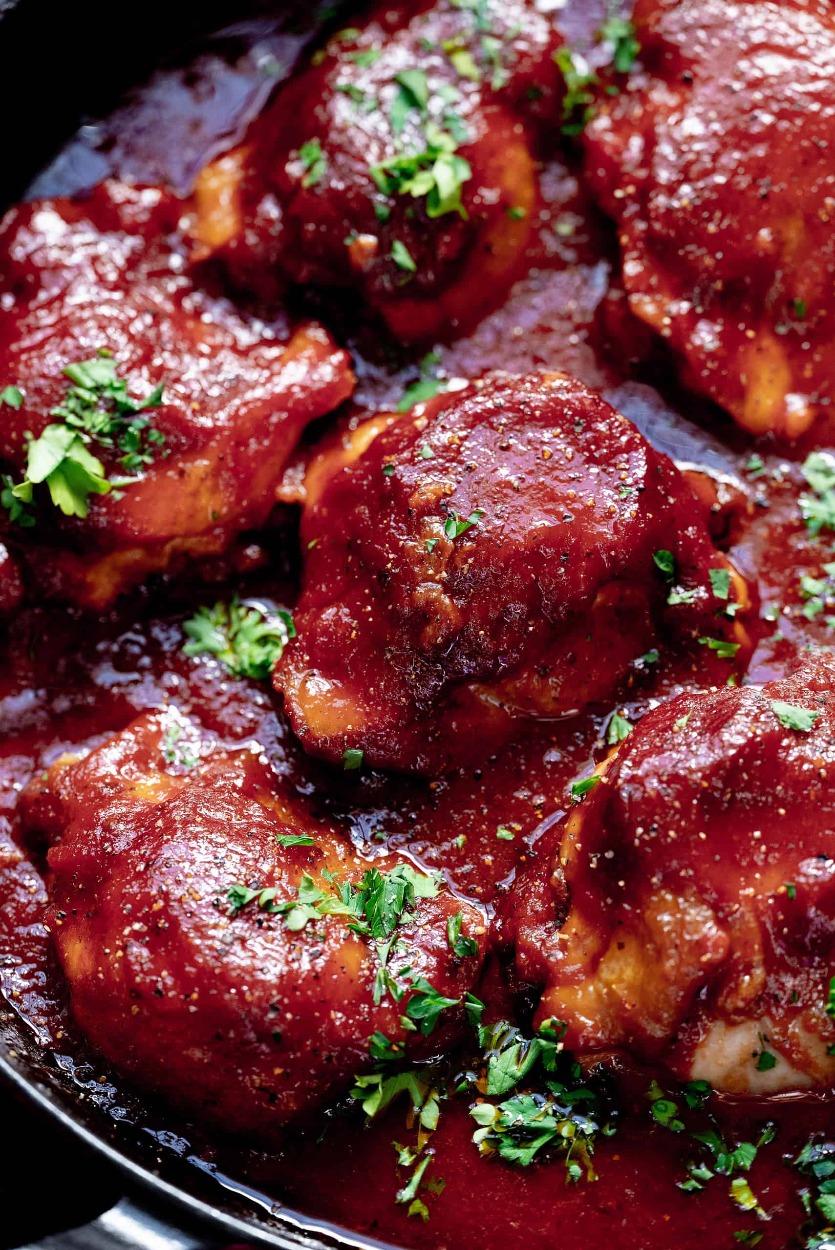 Close-up image of chicken thighs in a dutch oven. 