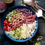 Featured image: Italian chopped brussels sprouts sald in a blue bowl.