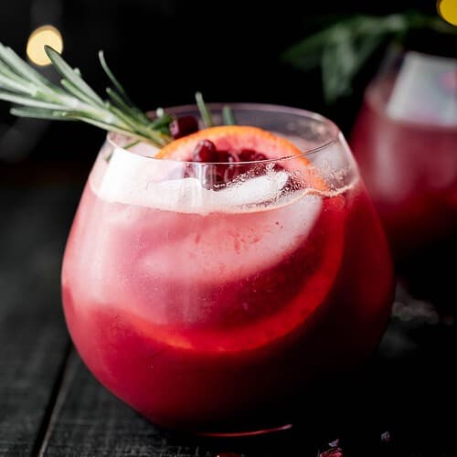 Hero image of ginger beer mocktail with a black background.