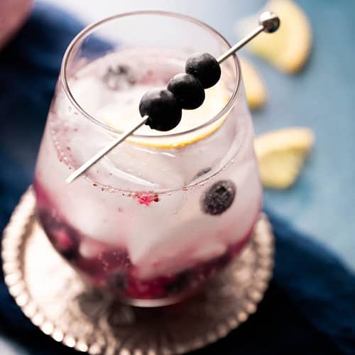 Blue mocktail on a blue background.