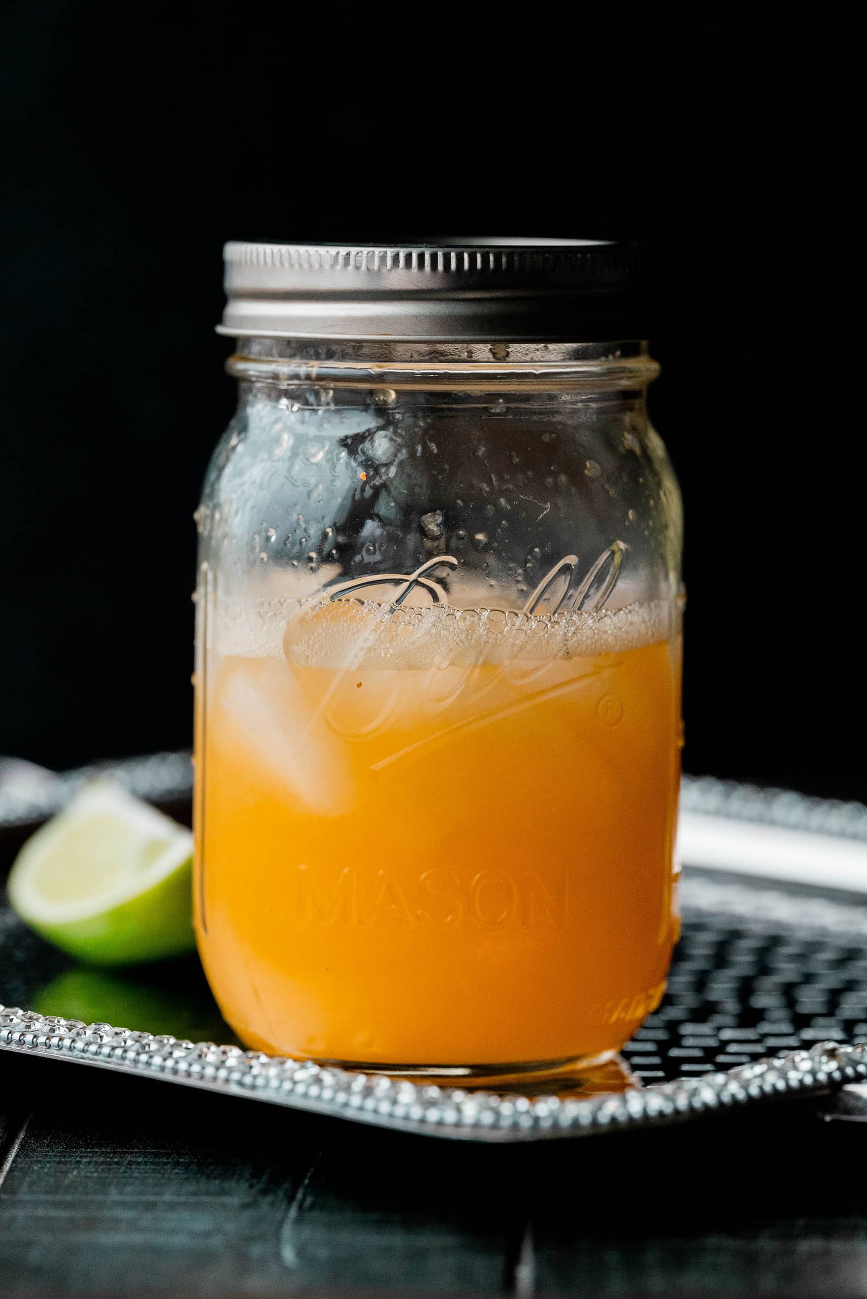 Orange liquid in a mason jar. 