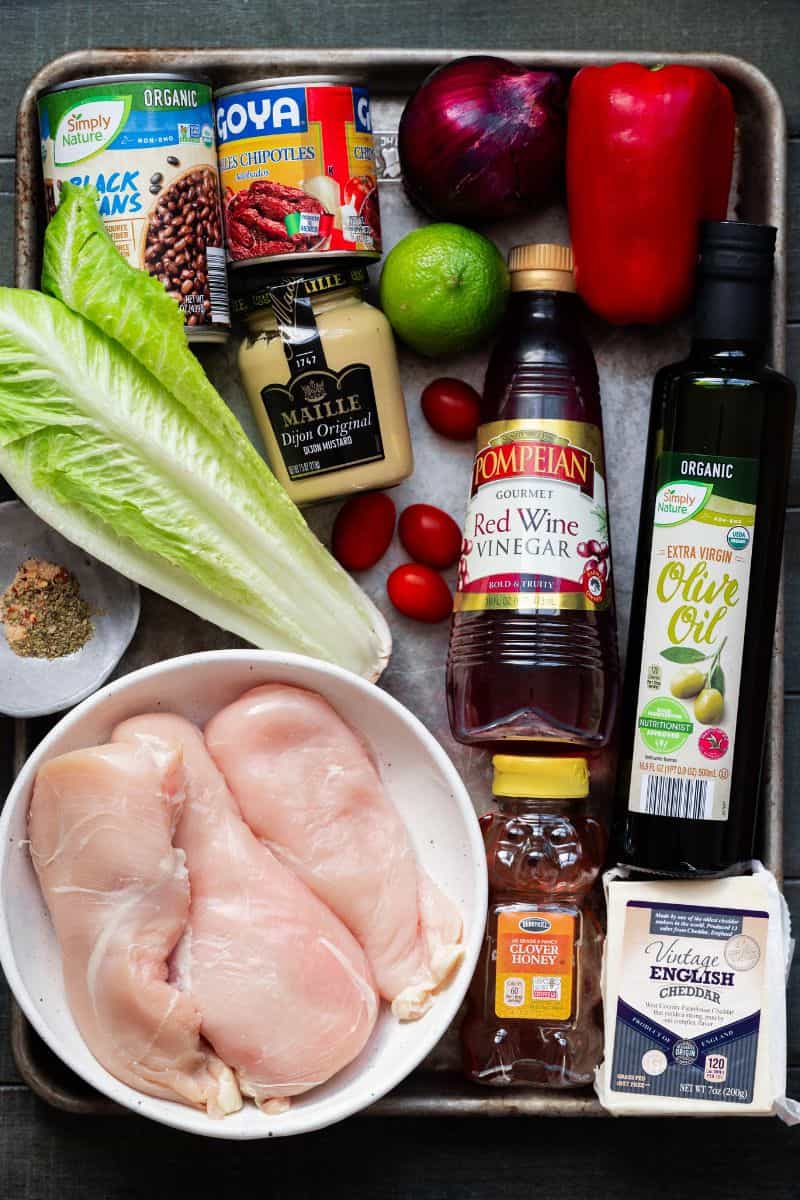 Ingredients needed to chicken fajita salad on a sheet pan. 