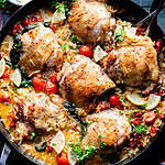 Overhead image of "marry me" Chicken Thighs with Orzo and sun dried tomatoes.