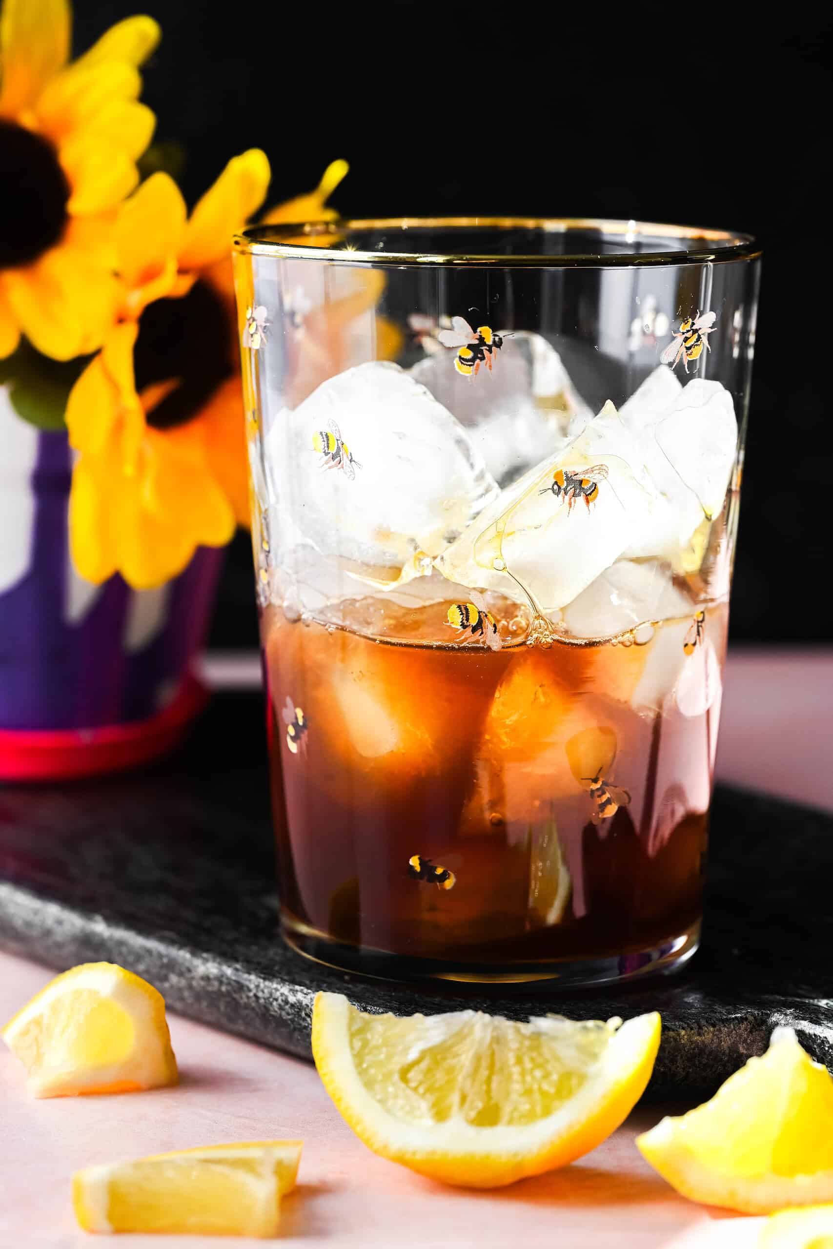 Process shot of the mocktail being made (tea over ice in a glass). 