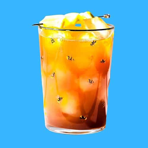 Hero image of dandelion detox mocktail on a blue background.