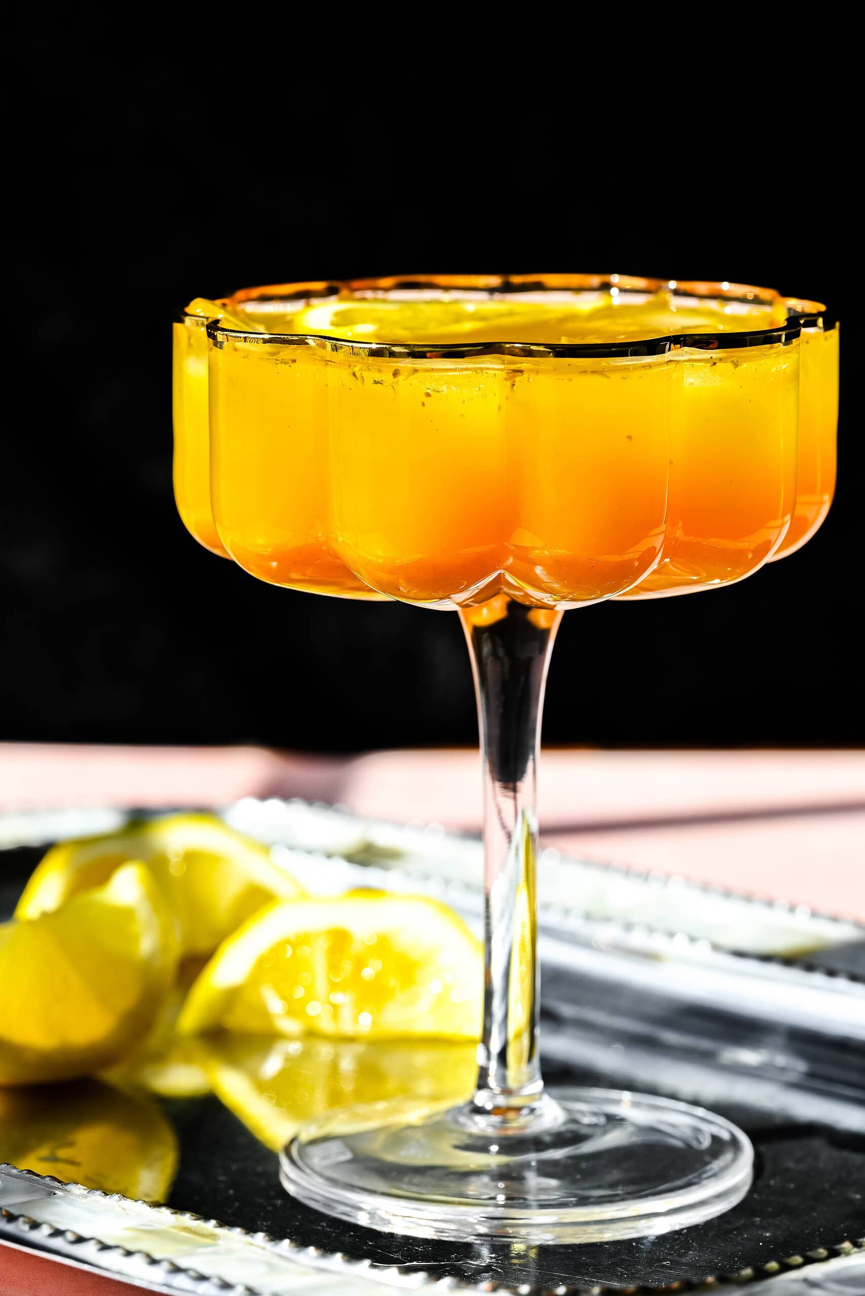 Image of mocktail with lemon garnish. 