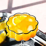 Pineapple and ginger mocktail on a plate.