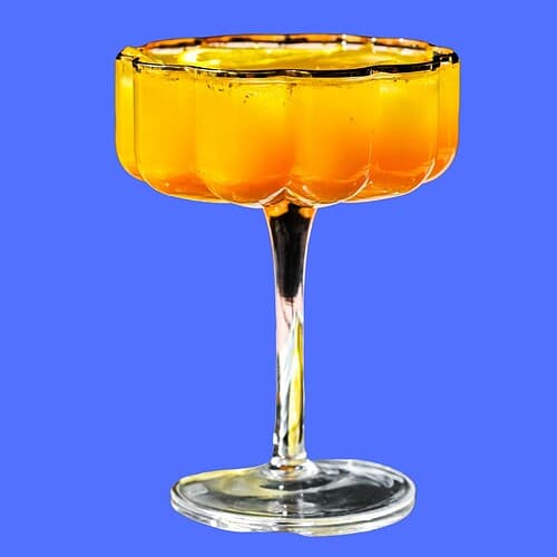 Hero image of a mocktail on a blue background.
