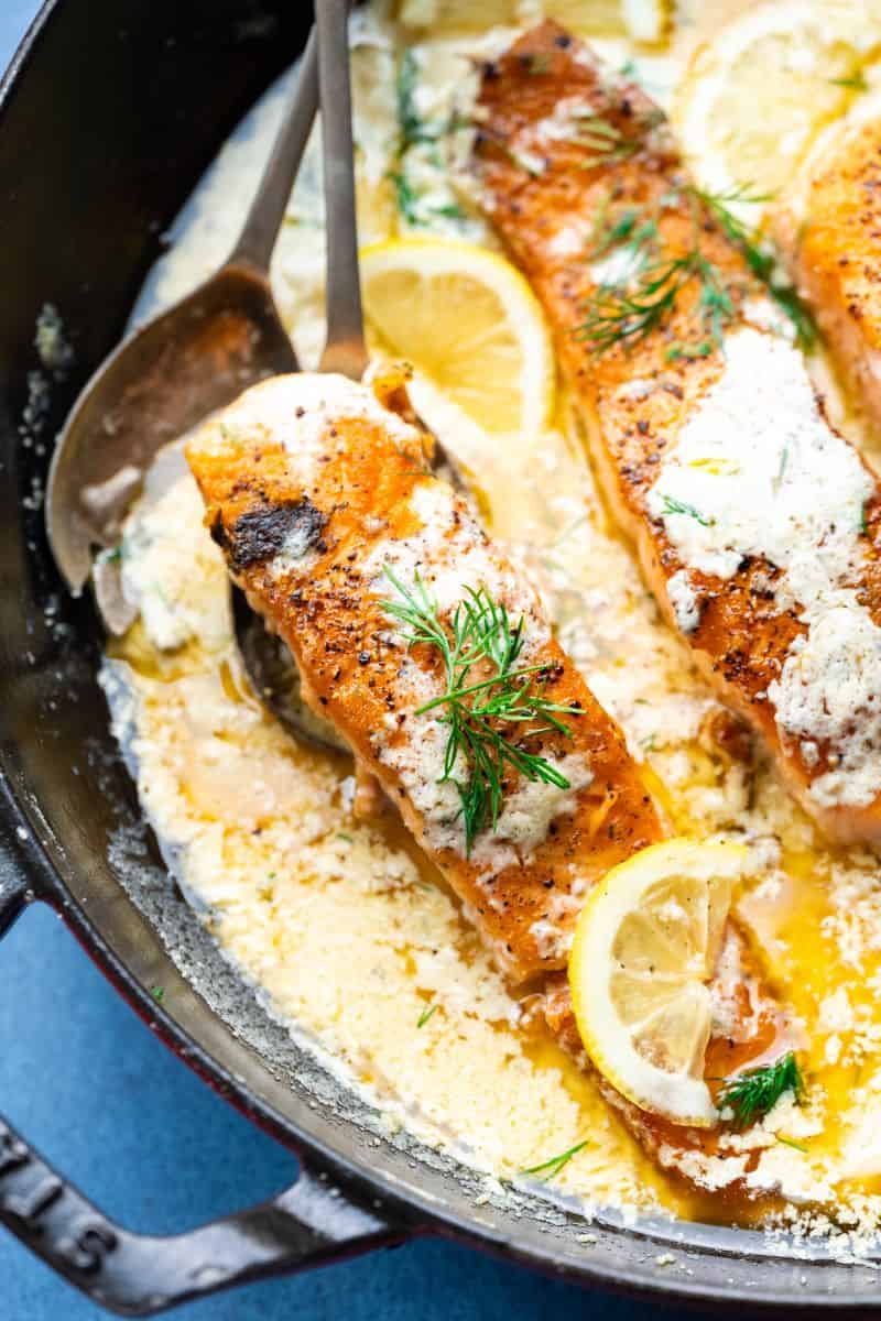 Salmon in a pan with dill and lemon. 