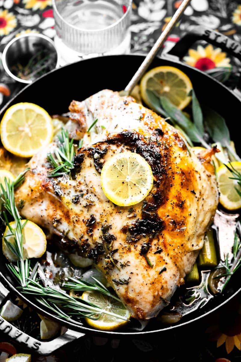 Overhead image of a dutch oven turkey breast roasted in a staub pan.