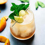 Bright picture of a mocktail in a short glass.