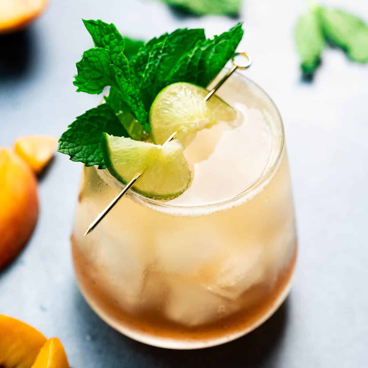 Mocktail with a lime and fresh mint leaves. 