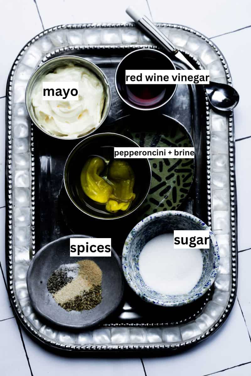 Ingredients with text overlay labels on a sheet pan. 