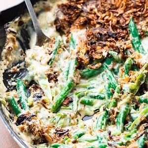 Close up image of green bean casserole with a spoon.