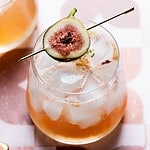 Close up image of a fig in a drink.