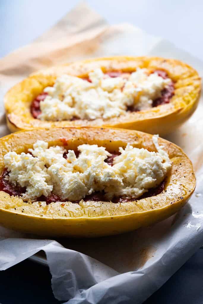 Squash boats with sauce and cheese.