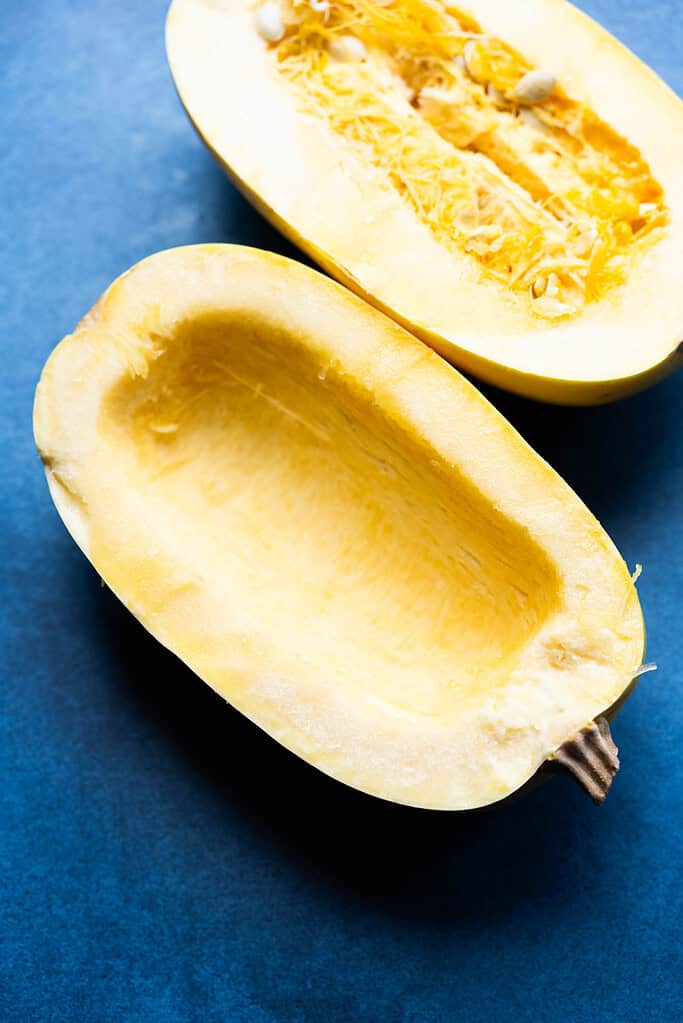 Spaghetti squash with seeds scooped out.